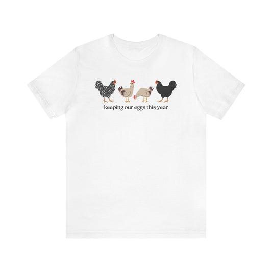 "Keeping Our Eggs This Year" T-Shirt | Humorous Womens Easter Tee Shirt | Funny Easter Tee Shirt for Her | Gift Ideas for Women | Easter Apparel for Ladies | Ladies Easter Tee Shirt